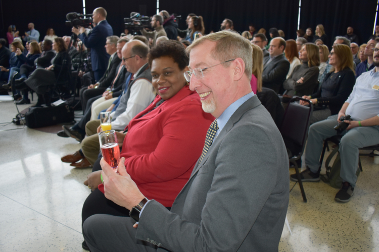 NENY Associate Director of Equity and Justice Ebony Hattoh and NY-BEST Senior Director and Program Manager John Cerveny toast to the Engines announcement in the crowd.